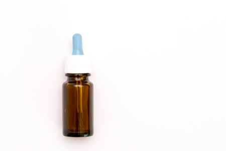 Serum dropper bottle mockup. Cosmetic oil glass container. Eyedropper medical package template, natural aroma essence set.の写真素材