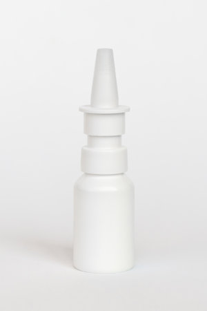 Template small plastic bottle with pipette, with cap, jar for drops for treatment nose, eyes ears, on background.の写真素材