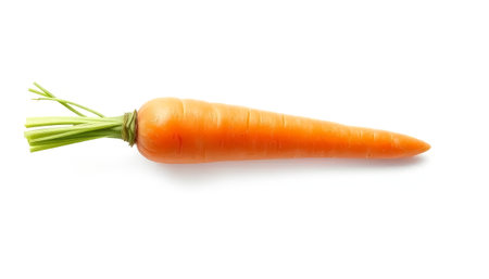 A carrot is shown on a white background. It is long and thin, with a green stem at the topの素材