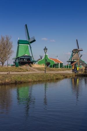Traditional Dutch old wooden windmill in Zaanse Schansのeditorial素材