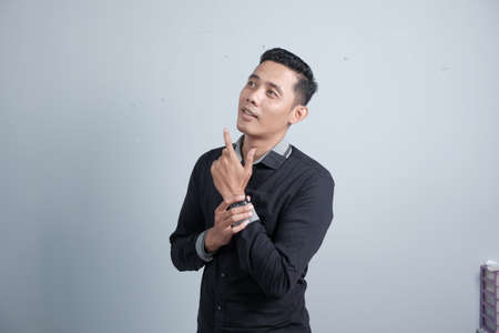 An attractive Asian man has different emotionsの写真素材