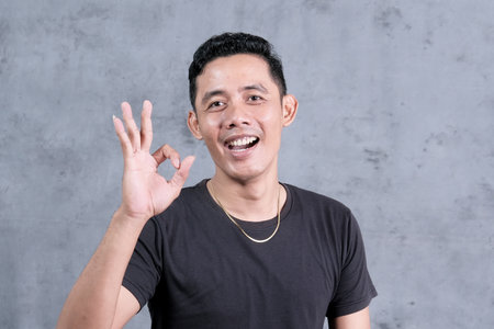 An attractive Asian man has different emotions