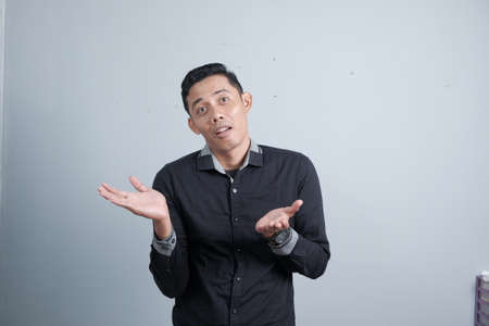 An attractive Asian man has different emotionsの写真素材