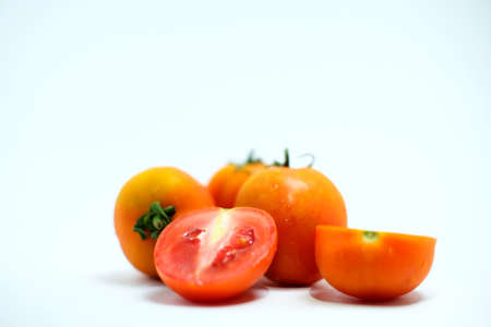 Tomato fruit or tomato plant isolated on a white background. Tomatoes contain lots of vitaminsの写真素材