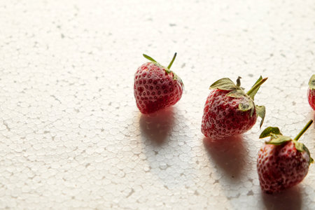 Fresh strawberries from the freezer on a white background. Whole strawberries with leaves. Strawberry set side view. Full depth of field.の写真素材