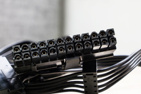 Close-up of black computer cable with connectors on a white backgroundの写真素材