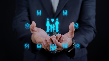 Businessman hand holding Family icon. security protection and health insurance.の写真素材