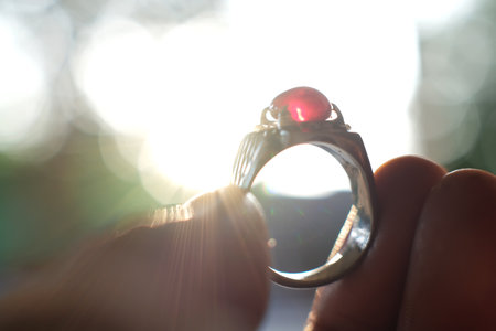 wedding ring in the hands of a man close-upの写真素材
