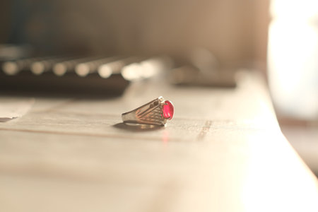 wedding rings on a wooden table, shallow depth of fieldの写真素材