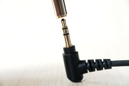 Audio cable with plug on white background, closeup. Audio equipmentの写真素材