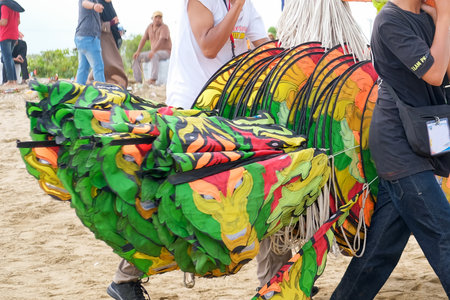Lampung, Indonesia-10 September 2022: Traditional Kite Festival, Creative Kite Competition, Tourist Attraction, Young People Prepare and Fly Kites on the Beachのeditorial素材