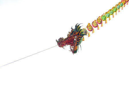 Dragon on rope isolated on white background, chinese new year conceptの写真素材
