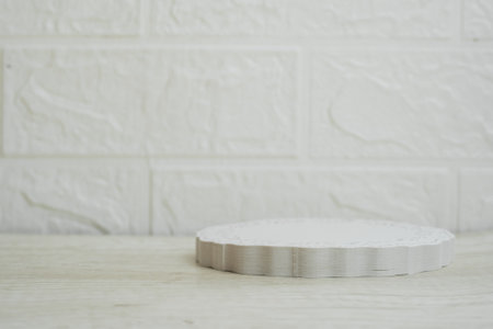Empty white podium on wood table and white brick wall background, product displayの写真素材