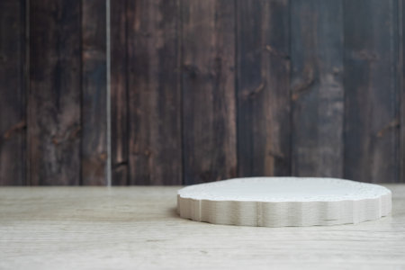 White round wooden podium on a wooden background. Mock up for product display.