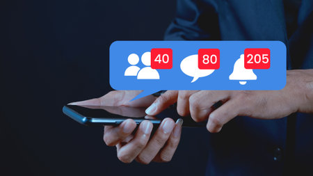 Male hand touching smartphone screen with attention icon on social media
