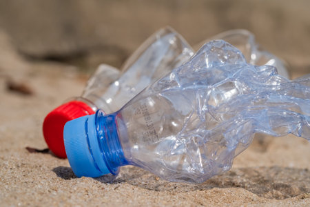 Garbage of plastic bottles on the beach, environmental pollution. climate change and global warming.