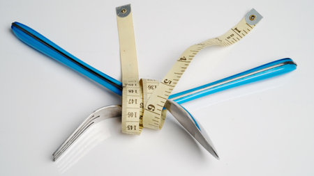 Fork and spoon tied with measuring tape, Weight control concept