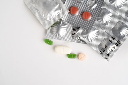 Different drugs tablets, pills in blister packs isolated on white background. macro, selective...