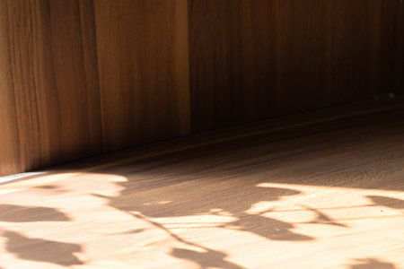 Wooden table with abstract light on old wooden backgroundの写真素材