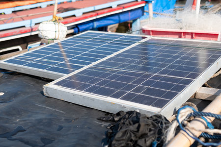 Solar panels are installed on the roofs of traditional fishing boats in Indonesiaの写真素材