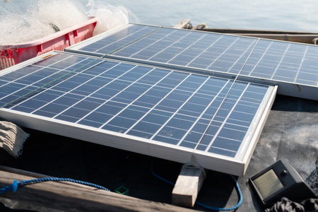 Solar panels are installed on the roofs of traditional fishing boats in Indonesiaの写真素材