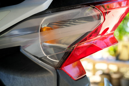 Detail of the rear light of a modern motorcycle, close-up