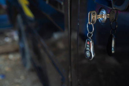 Closeup Of Vehicle Key With Remote In Door Lock