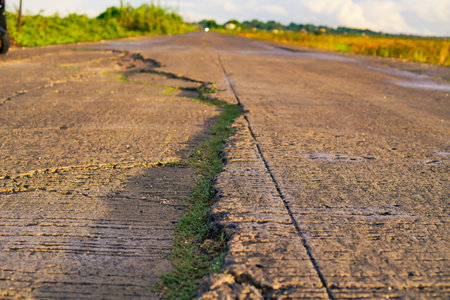 Close Up View Of Cracked Road Surface In Rural Areaの写真素材