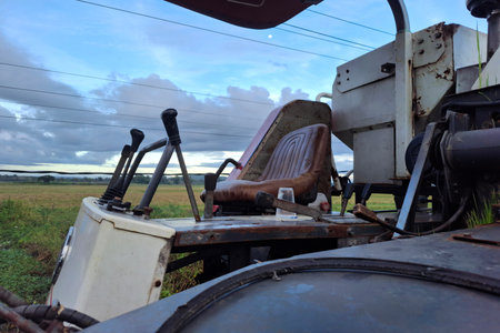 Old rusty combine harvester working on a farm in South Africaの写真素材