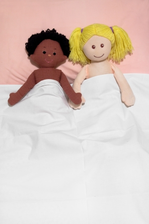 Interracial couple concept , with handmade rag dollsの写真素材