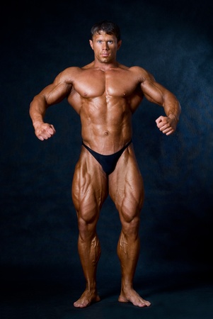 Muscled male model posing in studioの写真素材