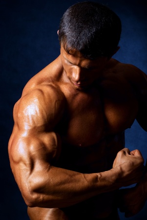 strong athletic man on black backgroundの写真素材