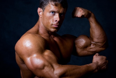 strong athletic man on black backgroundの写真素材