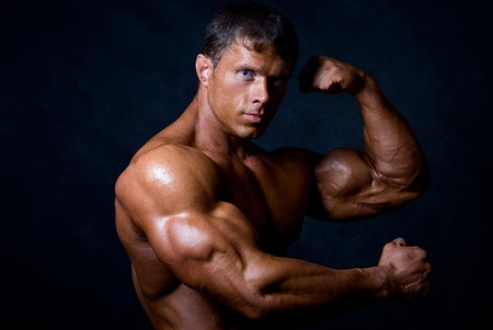 strong athletic man on black backgroundの写真素材
