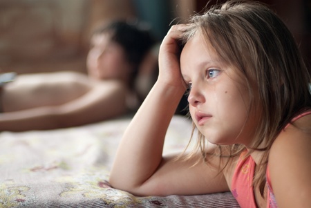 The girl watches film and criesの写真素材