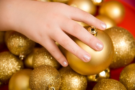 New Year's gold spheres on a red tableの写真素材
