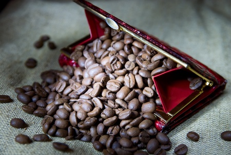 Coffee grains in a red purseの写真素材