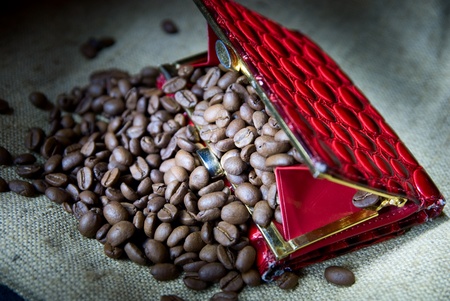 Coffee grains in a red purseの写真素材