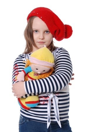 The beautiful little girl with a rag doll isolated on white backgroundの写真素材