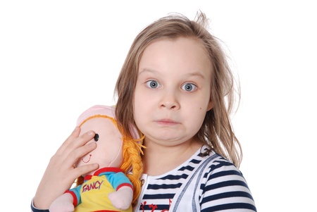 The girl and a doll isolated on white backgroundの写真素材