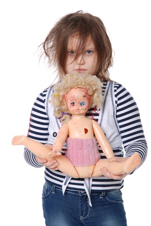 Little girl with spoiled doll isolated over white backgroundの写真素材