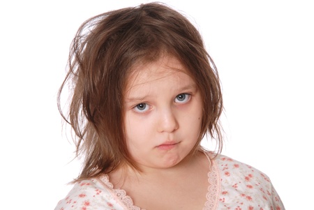 Portrait of the shaggy girl in a pajamas isolated on white backgroundの写真素材