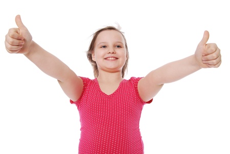 Portrait of the smiling girl showing thumbs isolated on white backgroundの写真素材