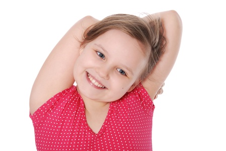 The girl has combined hands behind a head and smiles isolated on white backgroundの写真素材