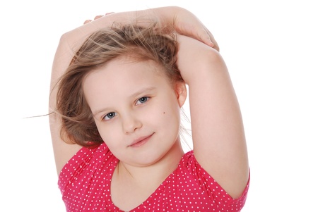 The girl has combined hands behind a head isolated on white backgroundの写真素材