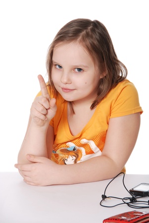 The little girl threatens with a finger isolated on white backgroundの写真素材