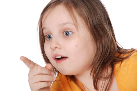 The little girl, points a finger isolated on white backgroundの写真素材