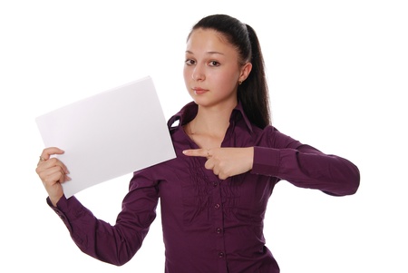 Portrait of a happy young businesswoman holding a blank bill board against white backgroundの写真素材