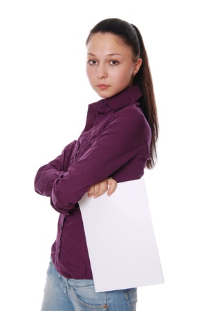Portrait of a happy young businesswoman holding a blank bill board against white backgroundの写真素材