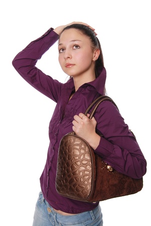 The beautiful girl with a bag on shoulders, looks upwards,verticalの写真素材